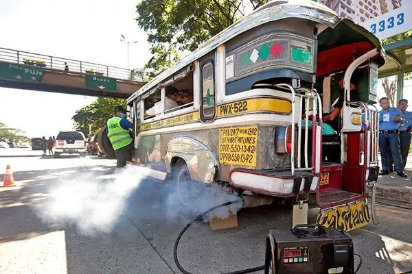 A jeepney emitting smoke