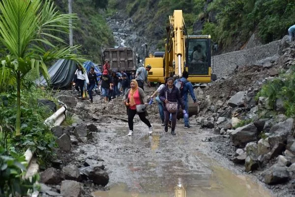 Kennon Road with pedestrians and a clearing operation