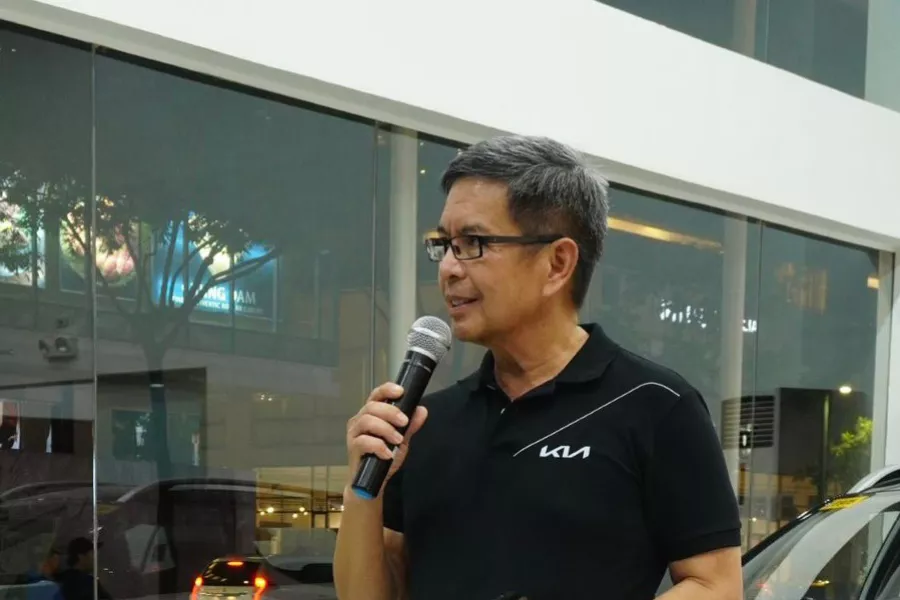 Kia Philippines President Manny Aligada in a Kia showroom