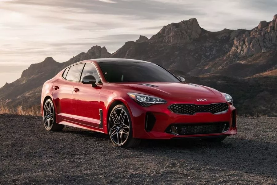 A picture of the 2022 Kia Stinger for the US parked in a dry, desert area