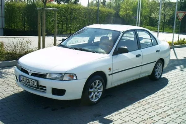 Almost everyone had a Lancer, or knew someone who owned one back in the 90's A picture of a parked Mitsubishi Lancer 1998