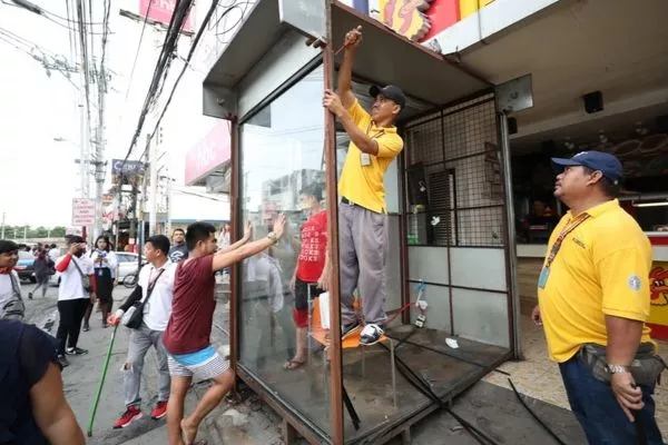 LGU employees clearing up some sidewalks