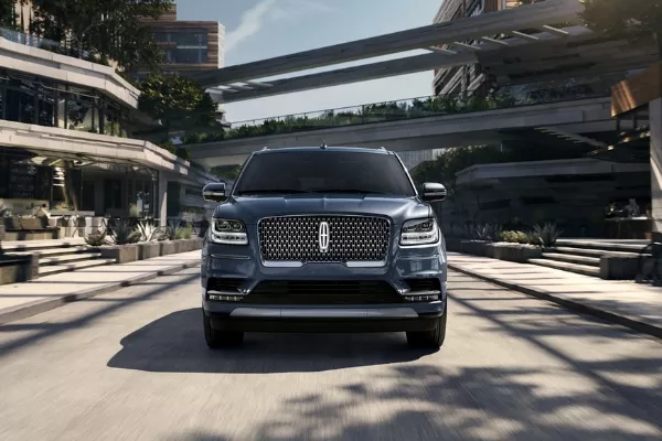A Lincoln Navigator on the road