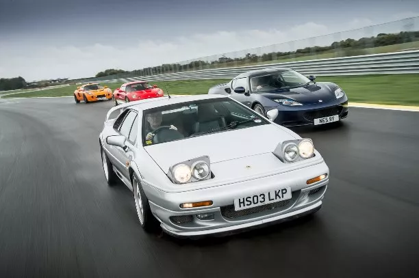 Four Lotus sports cars on the racing road