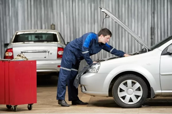 Man fixing his car