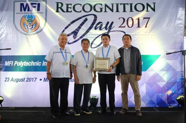 Four men in an event of MFI polytechnic institute