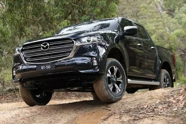 A picture of the 2021 Mazda BT-50 climbing a hill.