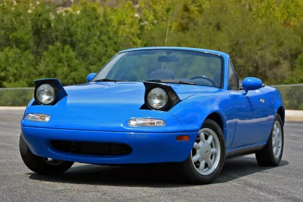 A blue Miata