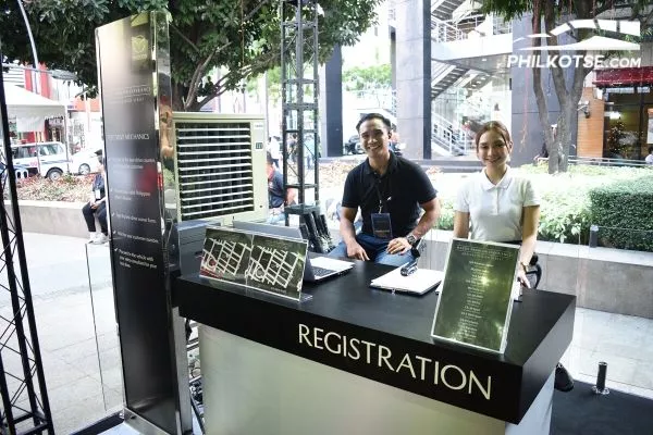 A picture of Mazda staff manning the Premium Experience Pavilion test drive registration booth.