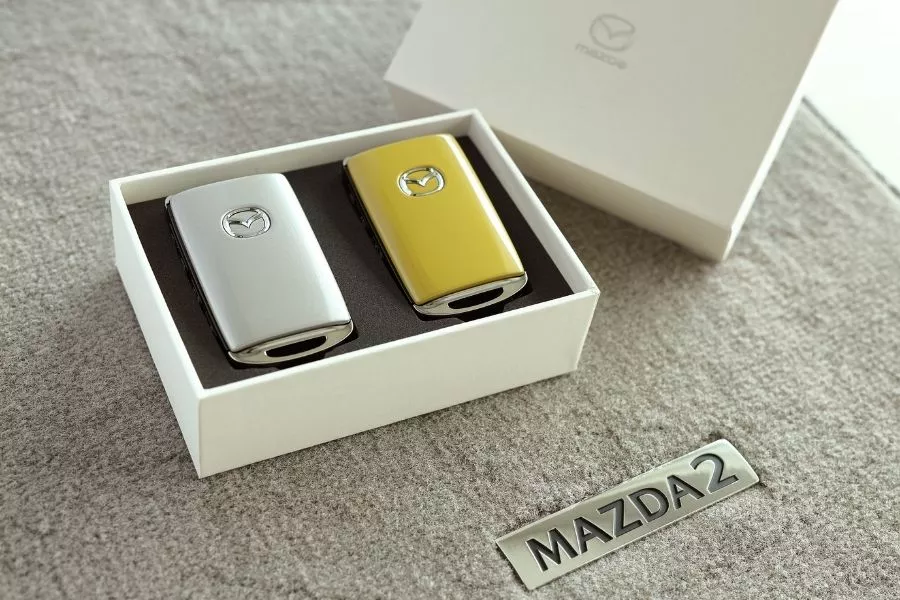 Mazda2 Sunlit Citrus key fob and floor mat