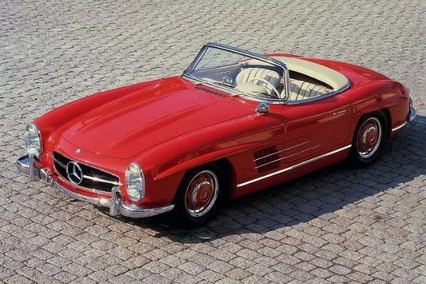 The Mercedes-Benz 300 SL A picture of a red Mercedes-Benz 300 SL with the top down.