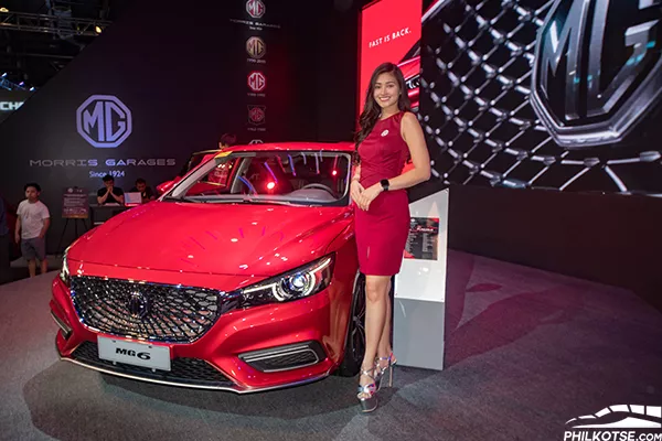 Fast is back with the 2019 MG 6 fastback sedan with 164 hp and 250 nm of torque, the MG6 is no slouch when it comes to performance A picture of the MG 6 sedan with a car show girl