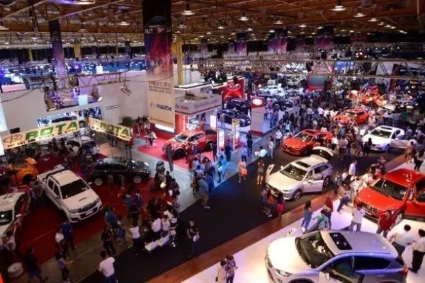 A picture of a car show in full swing