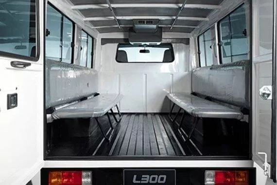A longtime partner of Filipino businesses Mitsubishi L300 cabin