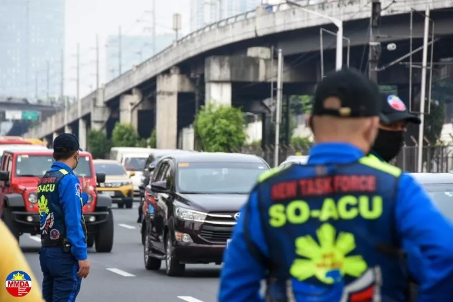 A picture of traffic enforcers on a road in Metro Manila