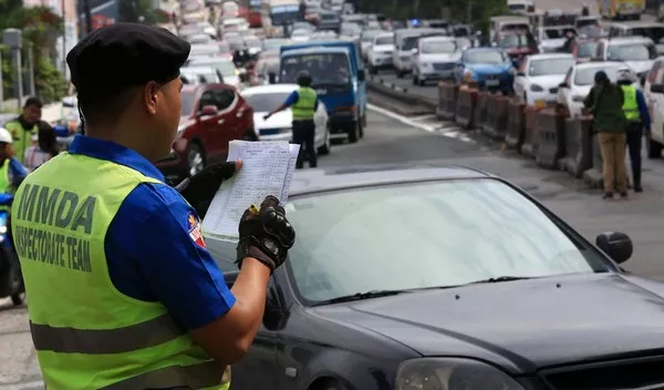 Traffic enforcer and car driver 