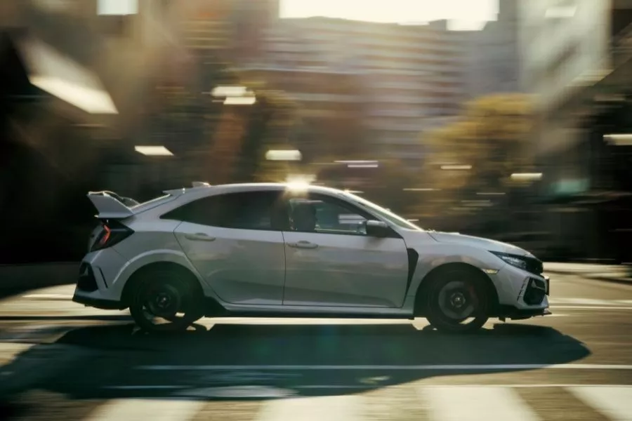 A picture of the side of the Civic Type R as it travels on city streets