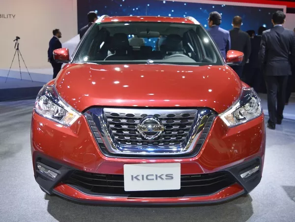 front of the Nissan Kicks at 2017 Dubai Motor Show