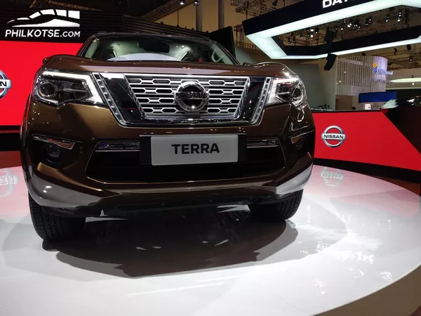 front of the Nissan Terra at the 2018 Gaikindo Indonesia International Auto Show