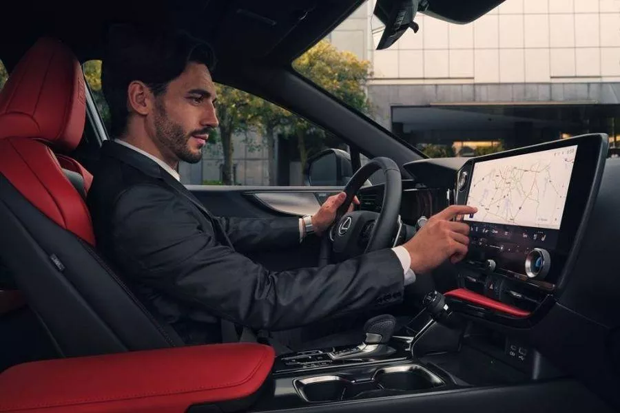 A picture of a man driving the new Lexus NX