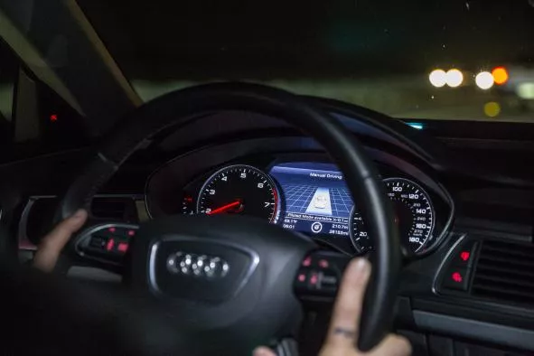 Autonomous cars are capable of automated driving at posted highway speeds Close up of an Audi steering wheel