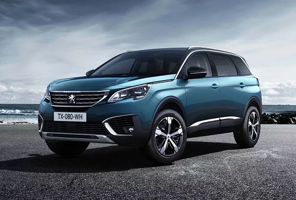 A picture of the Peugeot 5008 SUV near a pier.