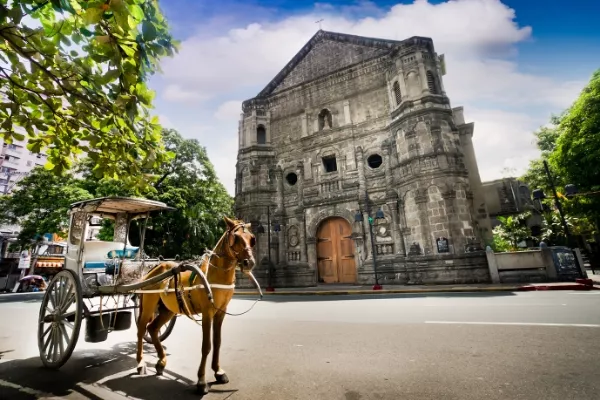 Kalesa beside a church