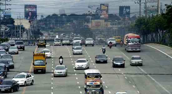 Cars plying on a Philippine highway