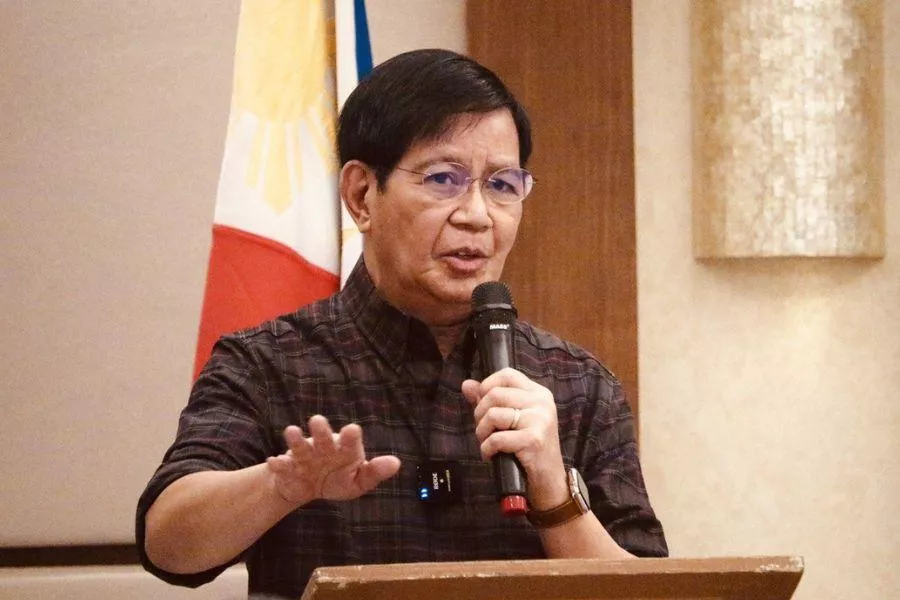 Senator Ping Lacson on a mic