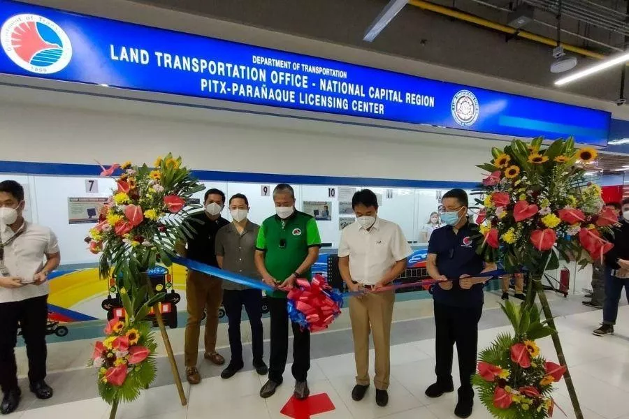 A picture of government officials cutting the ribbon at the LTO PITX licensing center's opening