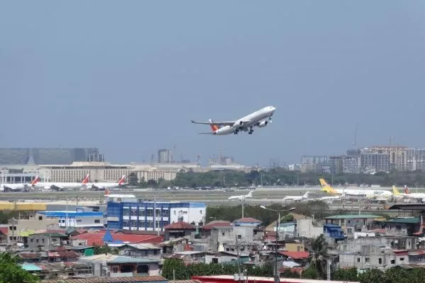 A picture of a Philippine Airlines plane taking off