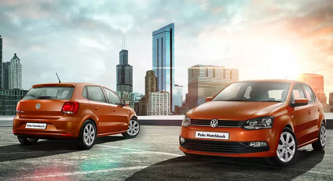 Two orange VW Polo hatchback front view and rear view