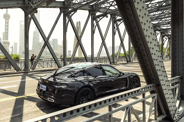 The Porsche Taycan EV on a bridge in China