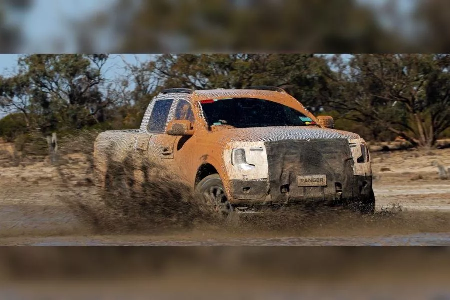 A picture of the 2022 Ford Ranger tackling muddy terrain