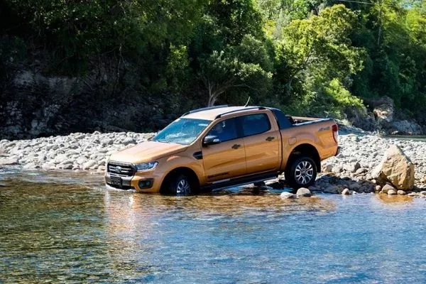 A picture of the Ford Ranger about to take a dip in the river