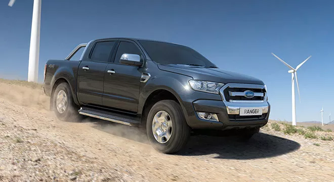 A grey Ford Ranger on the sand