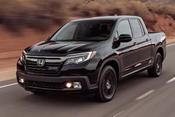 The Ridgeline travelling fast on a mountain road