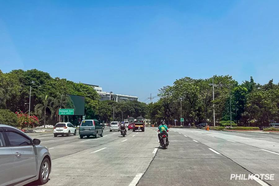 Cars and motorcycles by a Rotunda in the Philippines