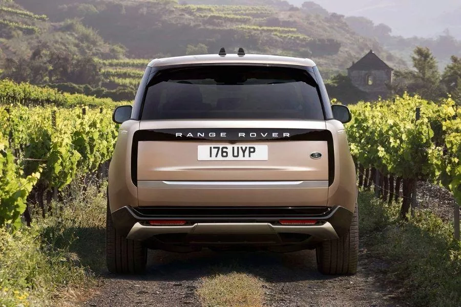 A picture of the rear of the 2022 Range Rover as it travels through an unpaved road