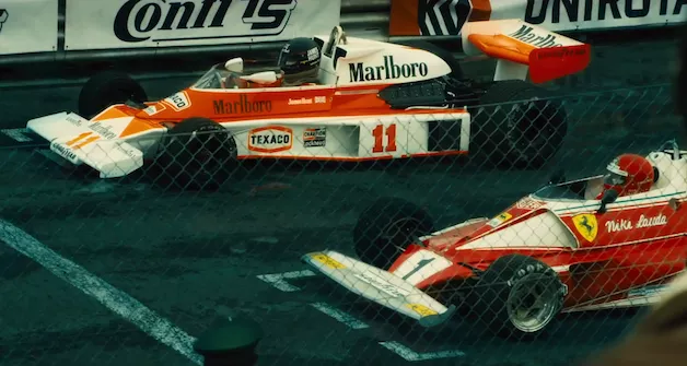 Two racing cars chasing each other