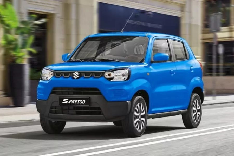 A picture of the Suzuki S-Presso Pearl Starry Blue in the city.