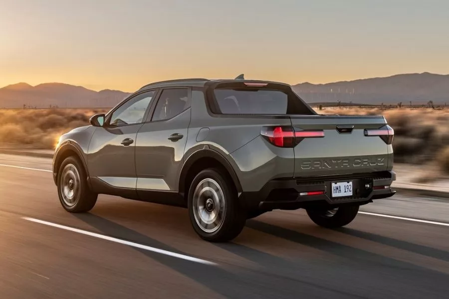 A picture of the rear-quarter panel of the Hyundai Santa Cruz as it travels on a road