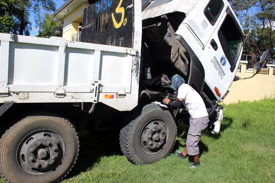 A picture of a person taking the stencil of a truck.