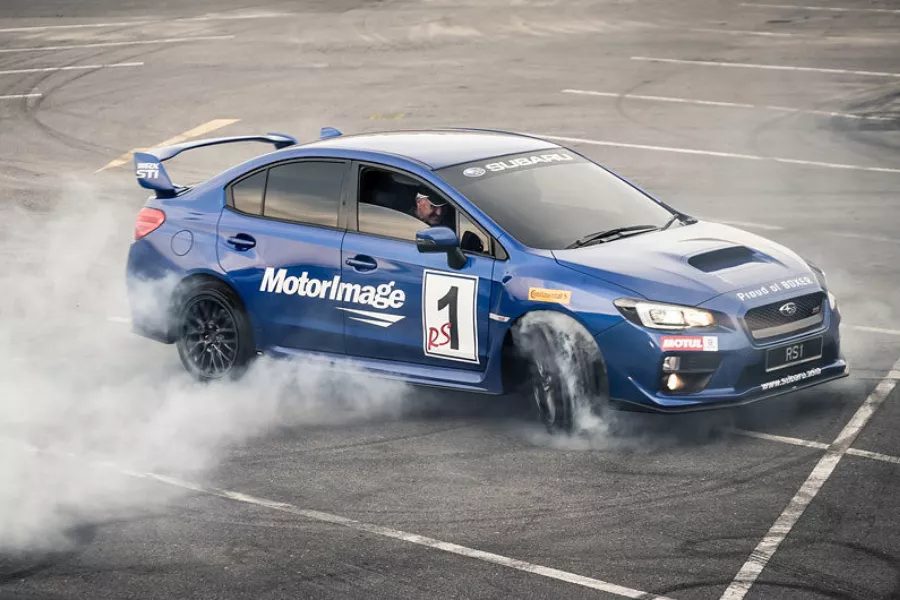 Russ Swift doing car stunts in a Subaru