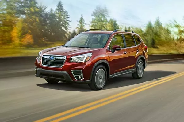 A red Forester on the road