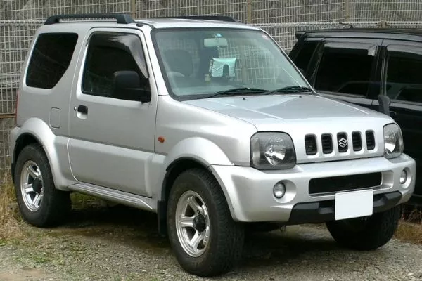 A picture of a 3rd gen Jimny on a parking lot