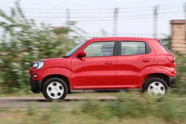 From the side, it looks like a cross-breed between an SUV and a hatchback A picture of the Suzuki S-Presso travelling fast on the road