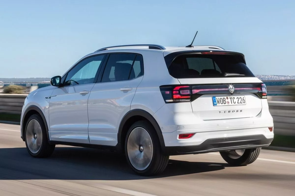 A picture of the rear of the T-Cross as it passes over a coastal road