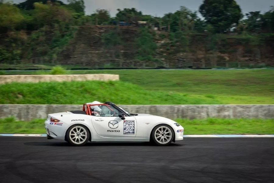 A picture of the MX-5 tackling a corner at the race