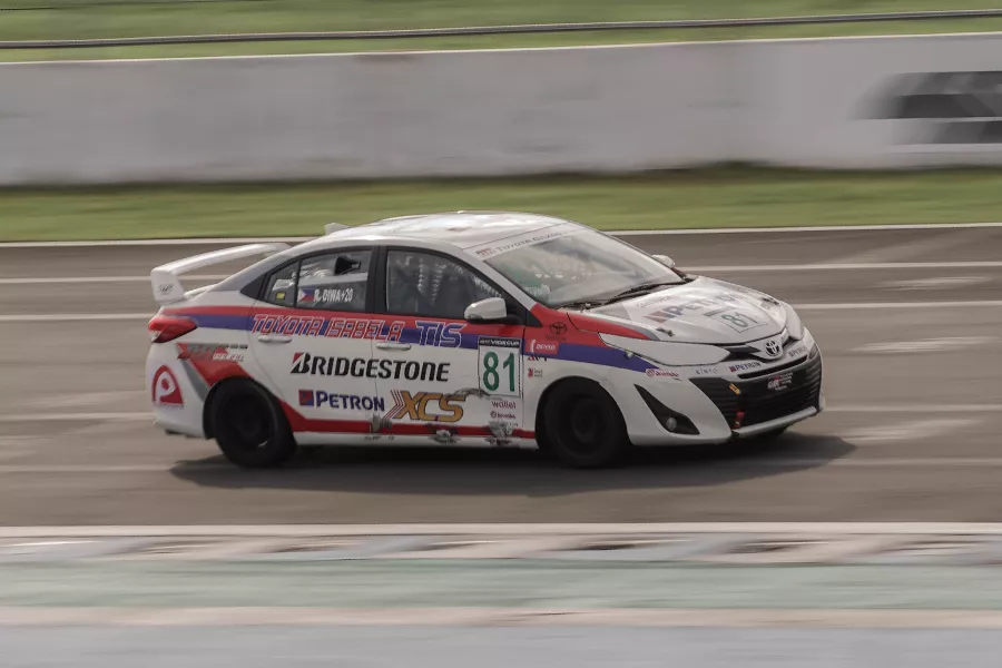 A picture of a Toyota Vios cup car on the track